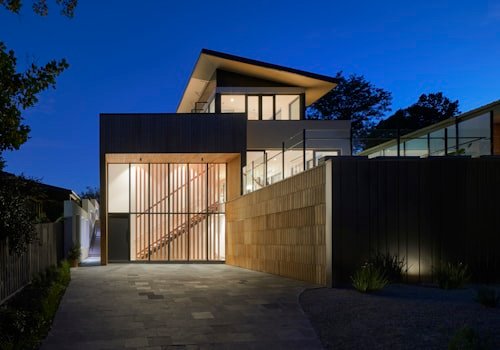 A home under construction, lit at dusk